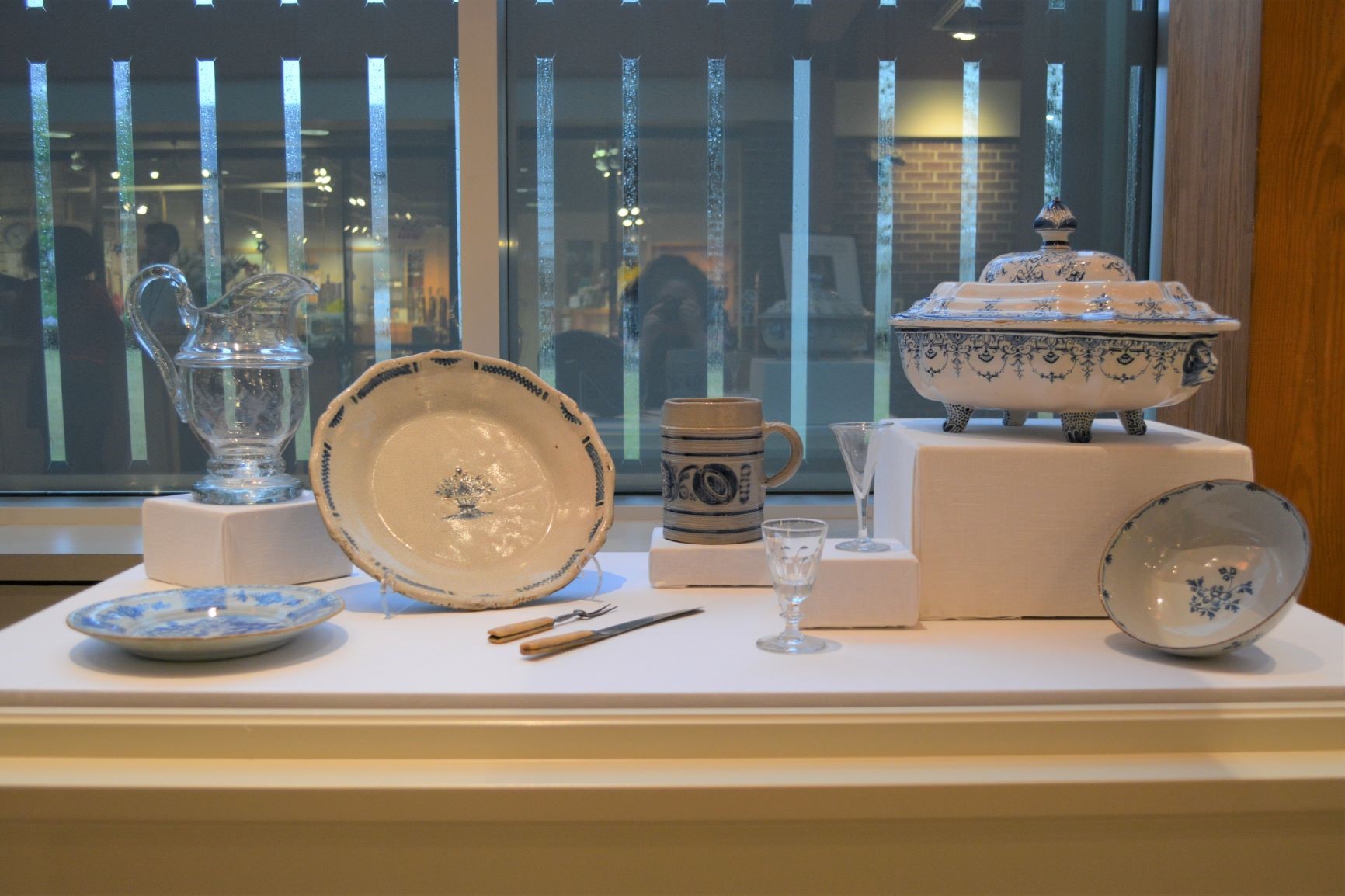 display of white dishes with blue decorative patterns