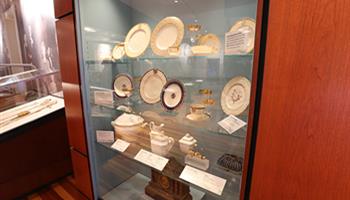 glass display case of dishes