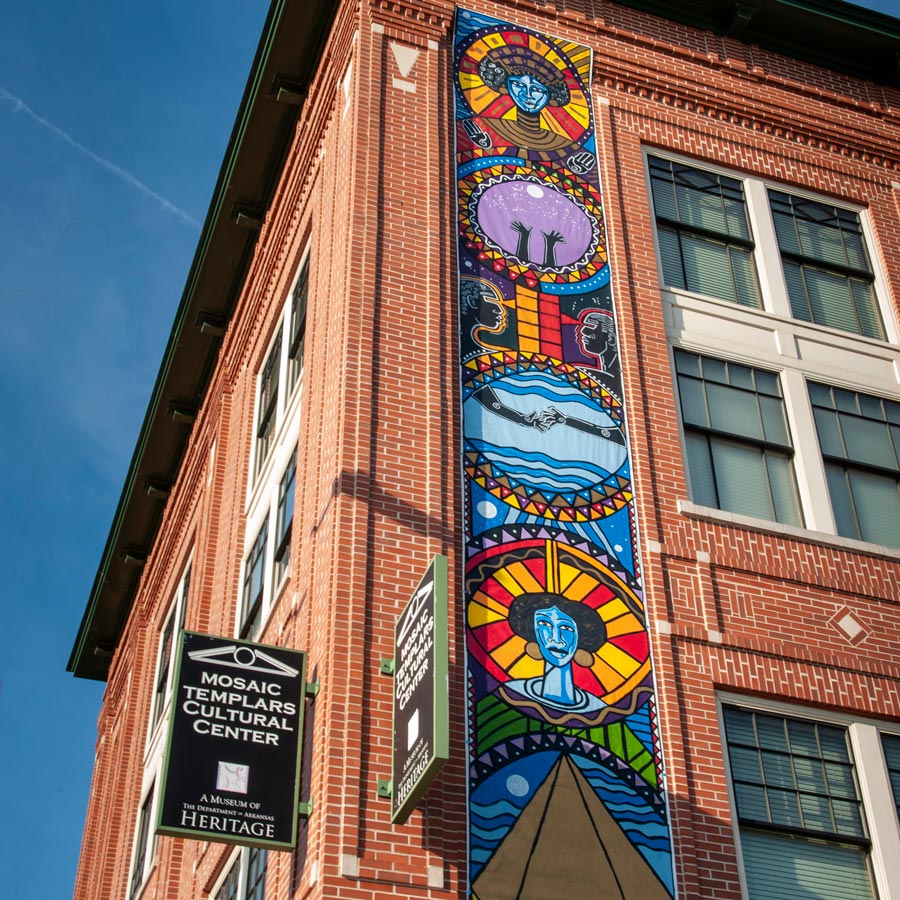 The corner of the Mosaic Templars Cultural Center building featuring a colorful mural.