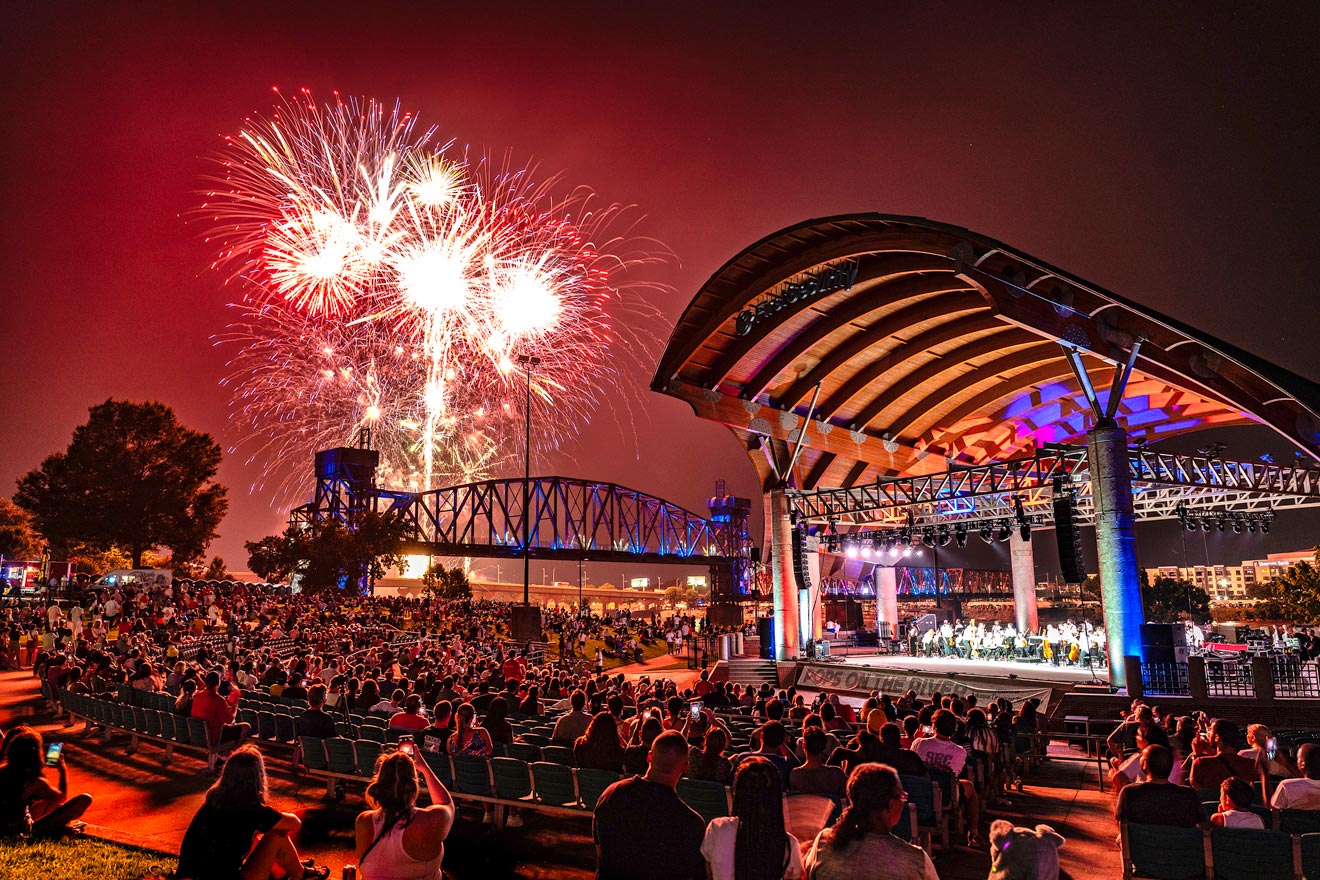 Fireworks shooting over the Little Rock River Ampitheater at Pops on the River 2025