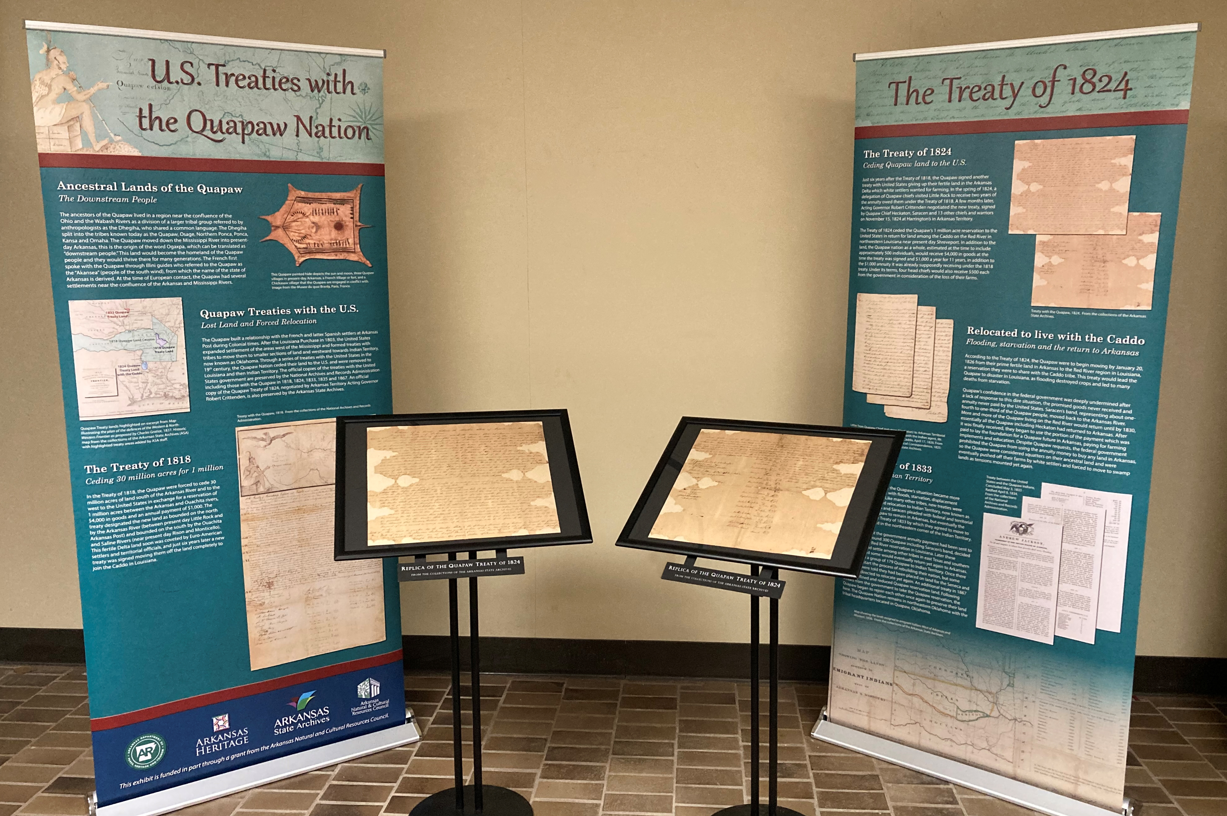 Two banners with information about the U.S. Treaties with the Quapaw Nation