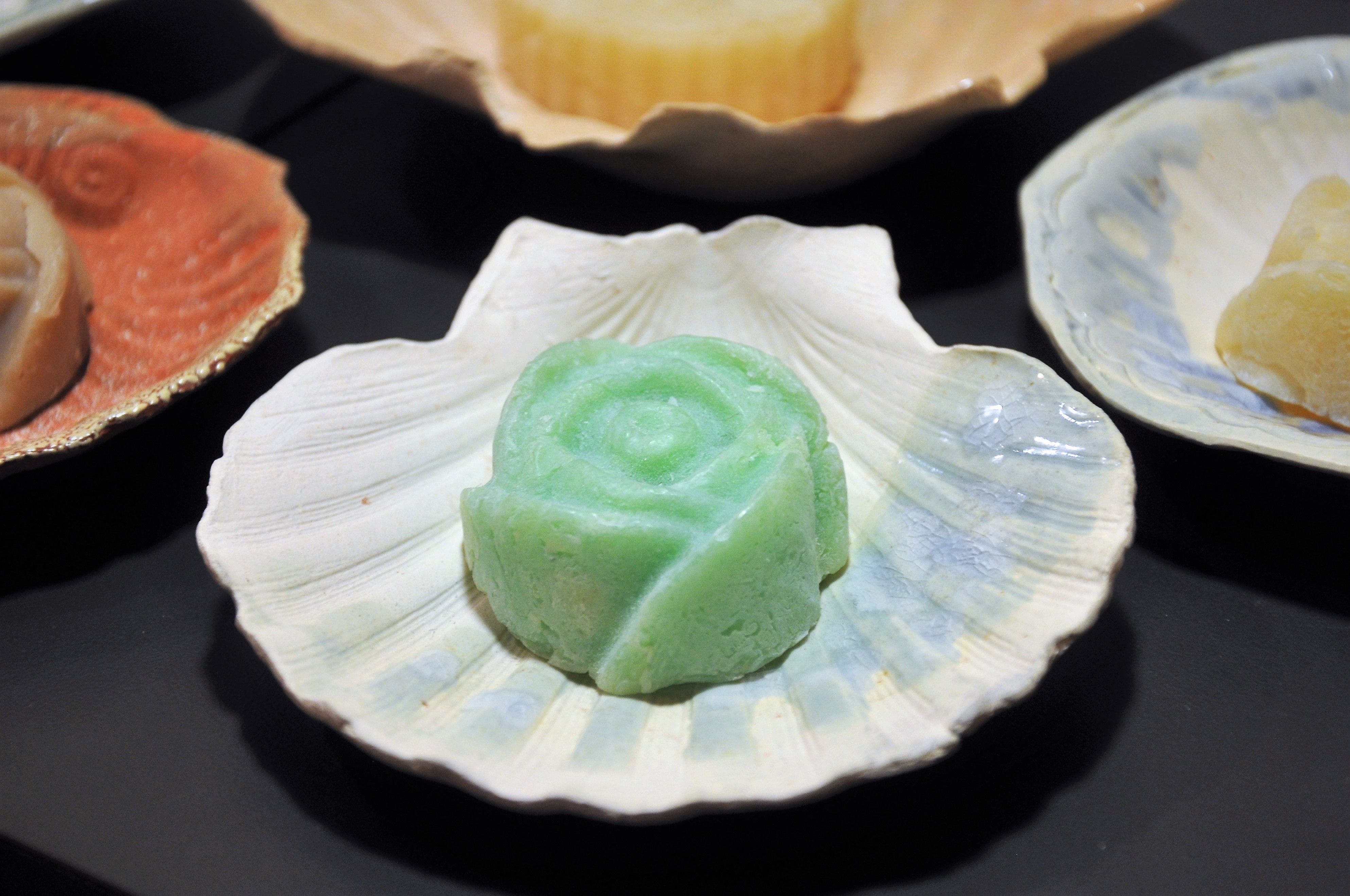 seashell soap dishes with colorful rosebuds of soap