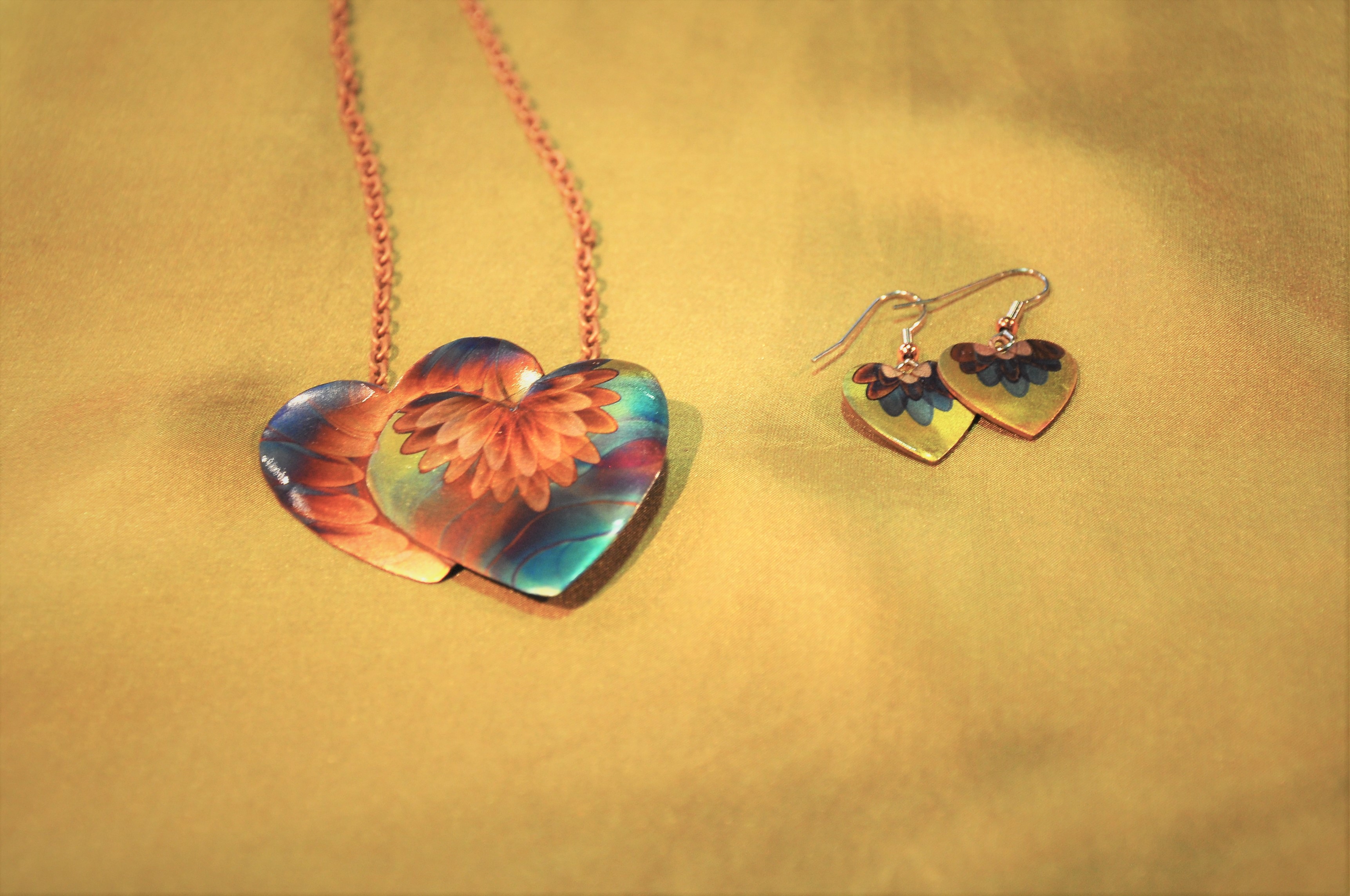 heart-shaped handmade jewelry with floral design: necklace and earrings