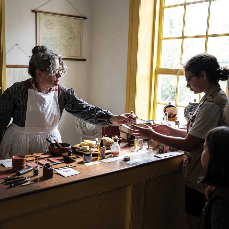 photo of woman and girl in shop