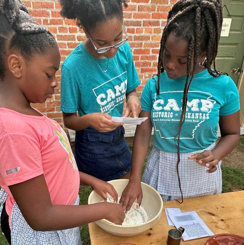 Campers making pie crust