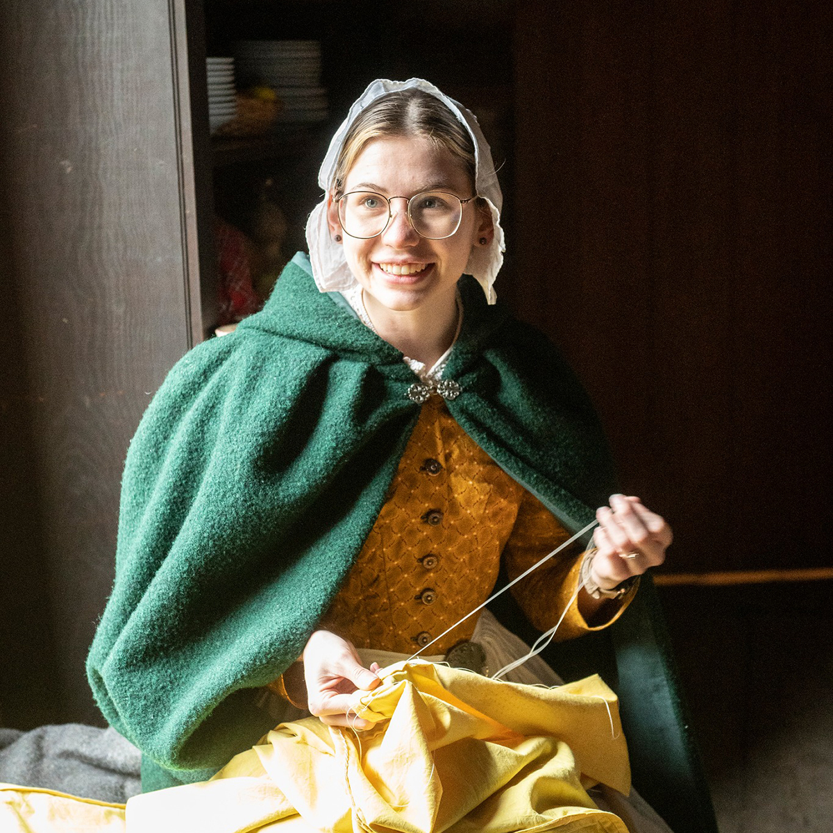 young woman sewing by hand
