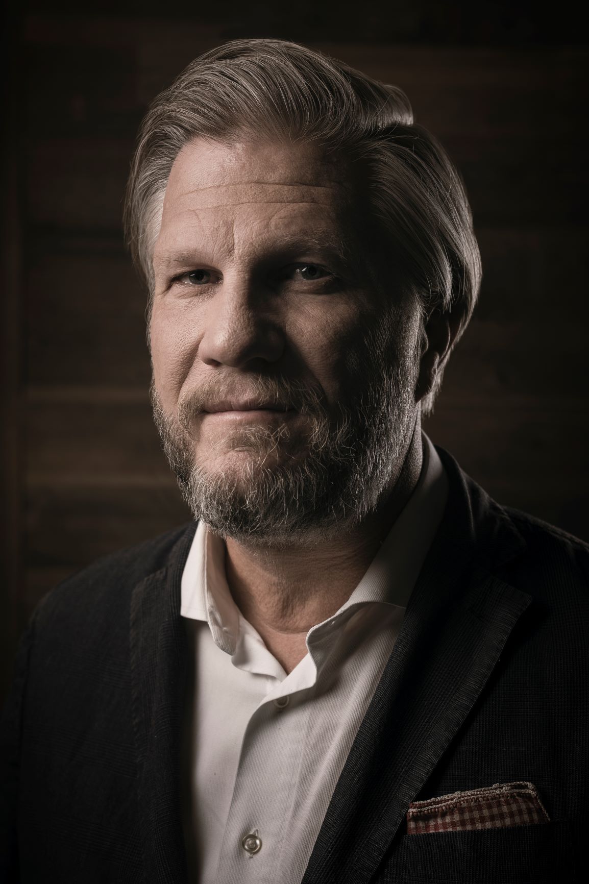 profile headshot of man with beard