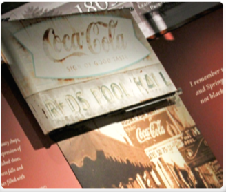 old coca-cola signs and images on display