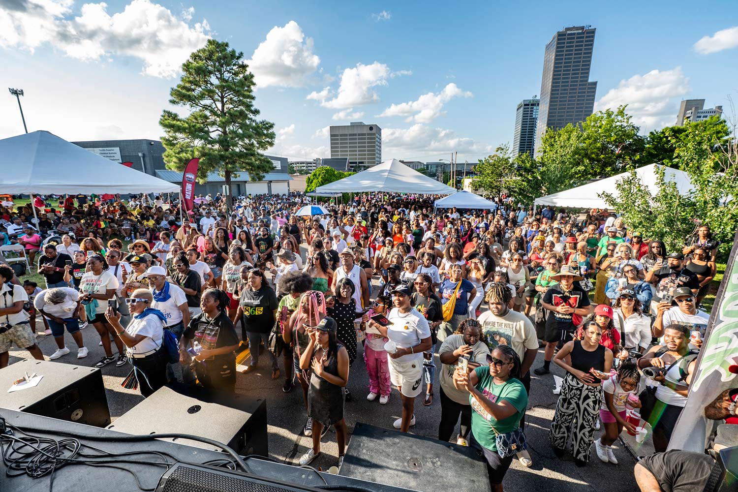 From the stage looking at a group of people facing the stage and watching performances.