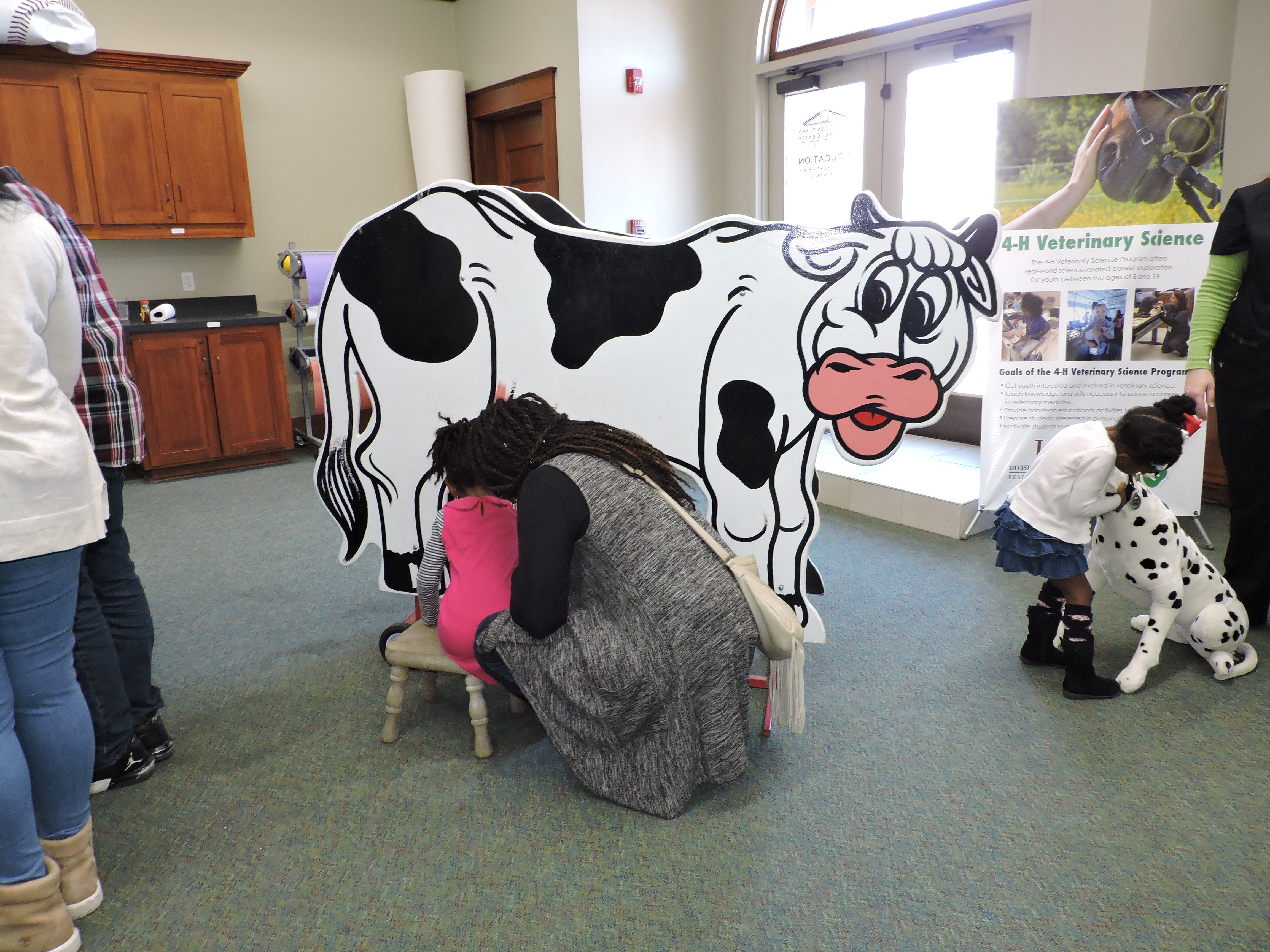 littlegirlandwomanmilkingpretendcow