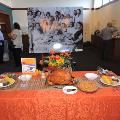 plasticfooddisplayofaholidaymealontableinfrontofblackandwhitegroupphotoaspartofexhibit
