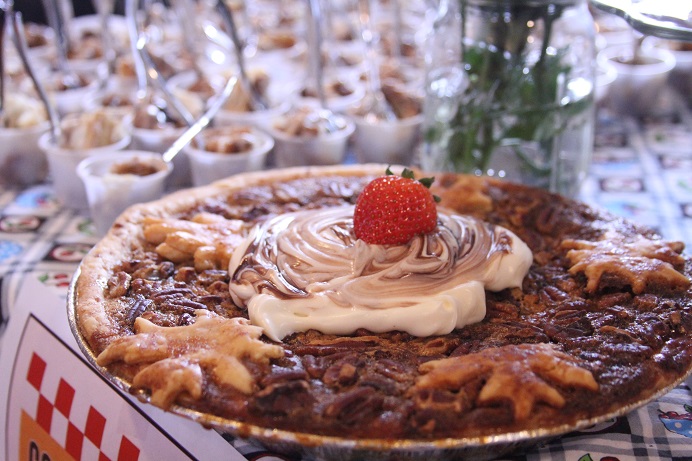 pecanpiedecoratedwithstrawberrywhippedcreamandleaf-shapedcrust