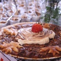 pecanpiedecoratedwithstrawberrywhippedcreamandleaf-shapedcrust