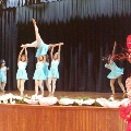 girlsinlightblueleotarddanceoutfitsdancingandperformingonstage