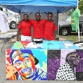 youngmeninredt-shirtsstandingbehindtablewithcolorfulgraphicartandt-shirts