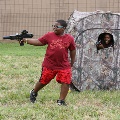 kidwithgunandkidincamouflagehuntingtent