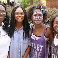 womanandgirlswearingglassesandsmiling