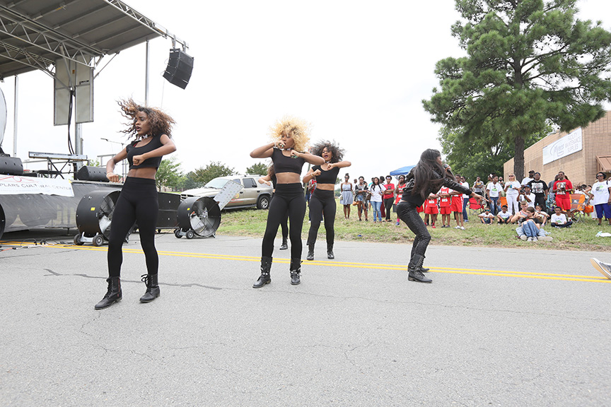girlsinblackbootsandpantsdancingandperforminginstreet