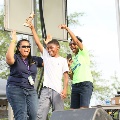 womenandboycelebratingandholdingupatrophy