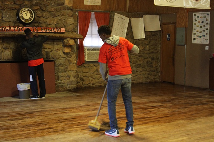 personsweepingwoodenfloor