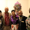 womenandmensmilingandstandinginfrontofexhibit