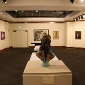 roomofmuseumexhibitswithstatuesandpaintings