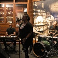 womansingingwithmenplayingkeyboardanddrums
