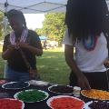 youngwomenstringingpastanecklaces