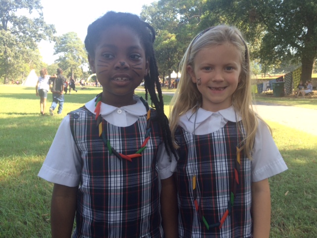 girlsinschooluniformswithfacepaintandnoodlenecklaces