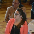 womaninbrownsuitjacketandwomaninsalmonjacketlookingahead
