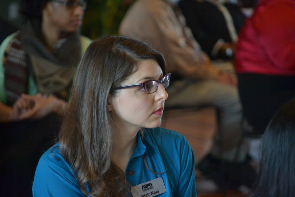womanwithglasseswearingbluecollaredshirt