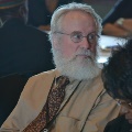 manwithbeardwearingglassesandcollaredshirtandtie