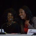 womenlaughingandtalkingintomicrophone